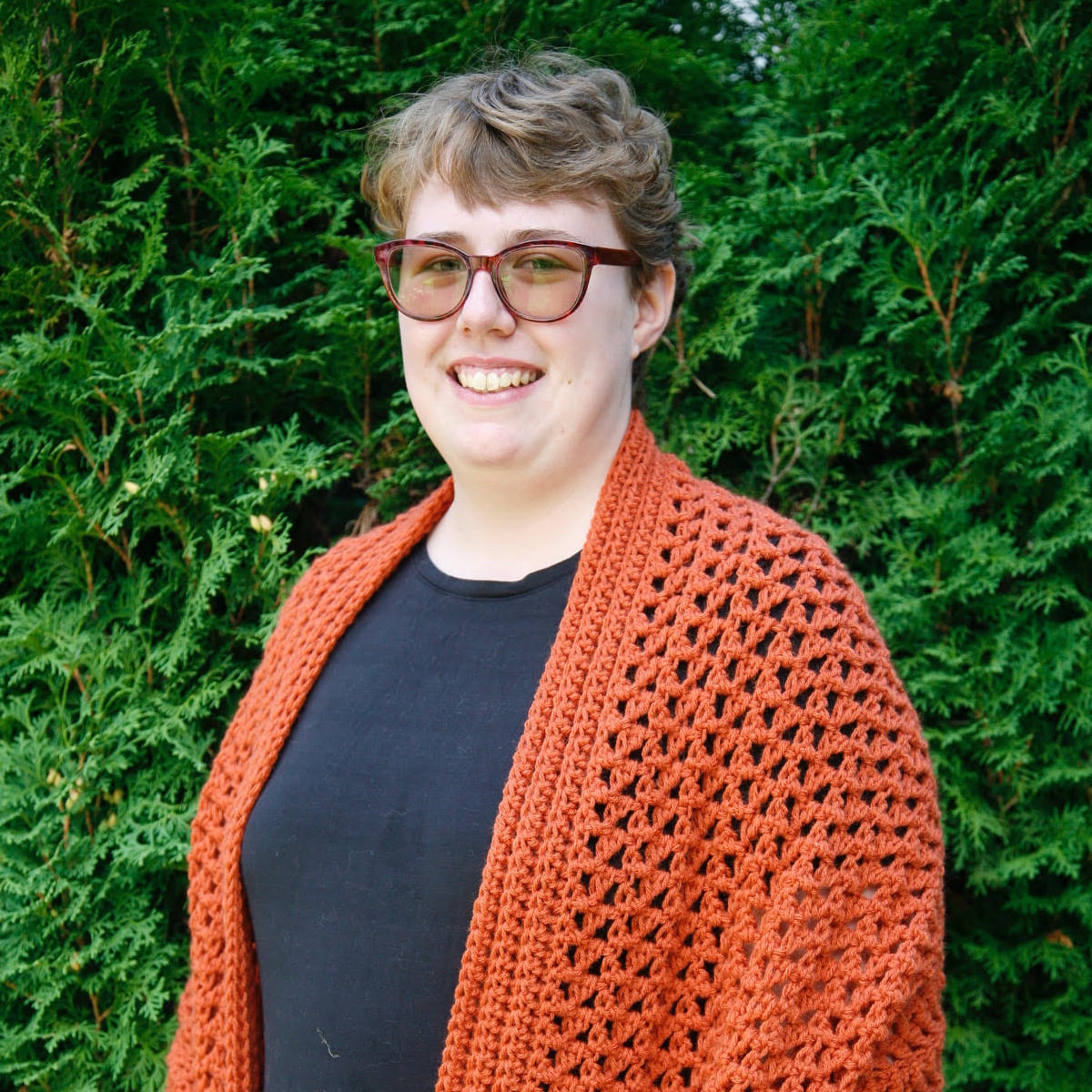 madison modeling an orange shawl she made